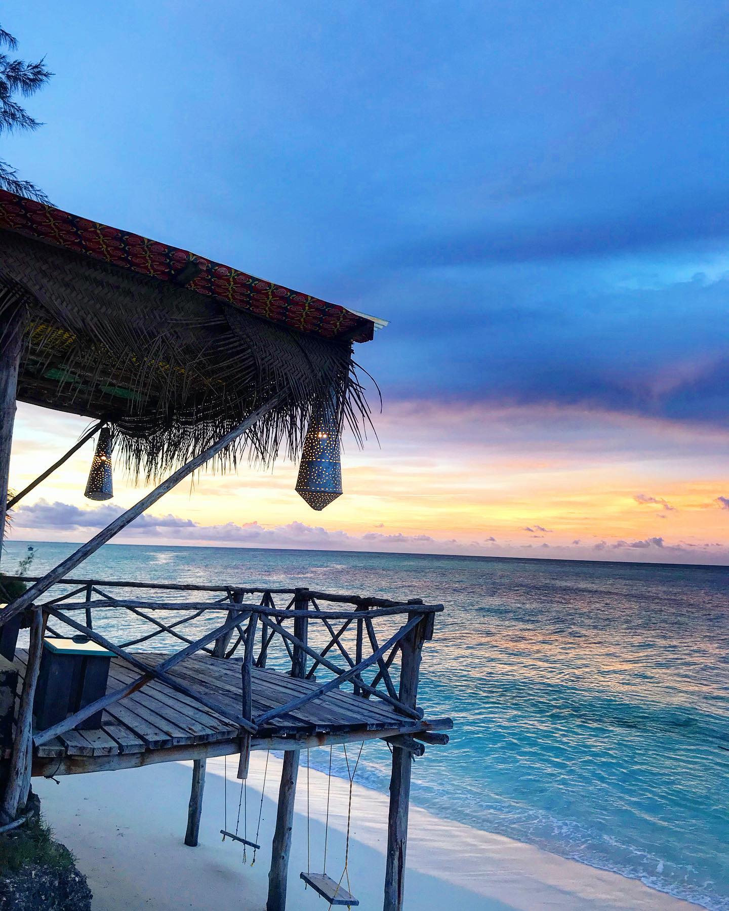 Sunset over the Indian Ocean from a beachfront banda, Zanzibar